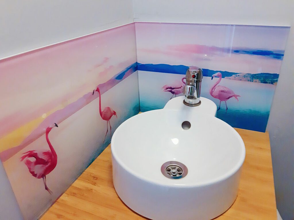 Printed Flamingos Image on Glass behind Sink